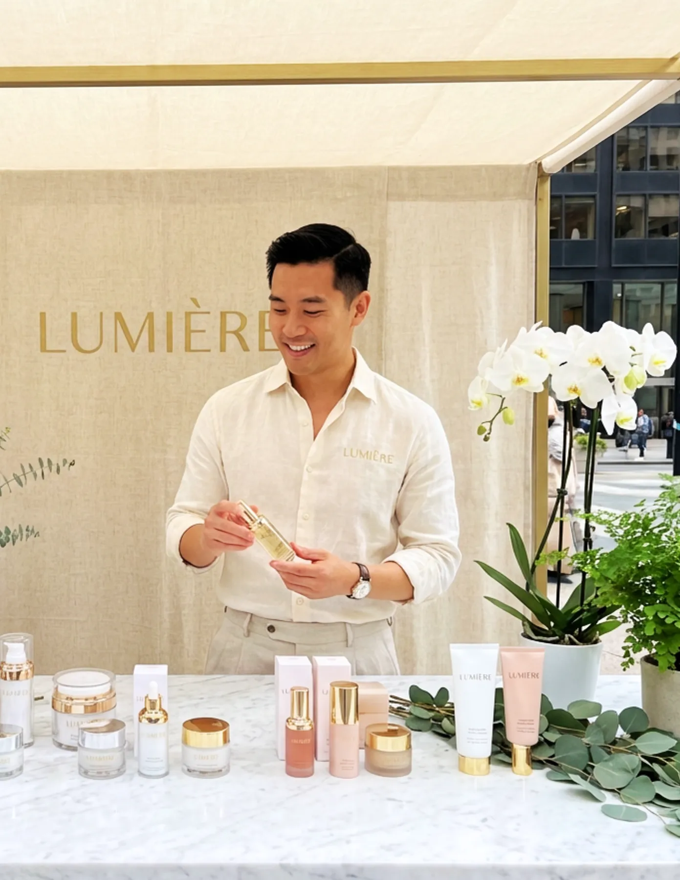HMG+ IMAGES-19 Brand ambassador standing behind a display table at a Lumiere outdoor pop-up kiosk