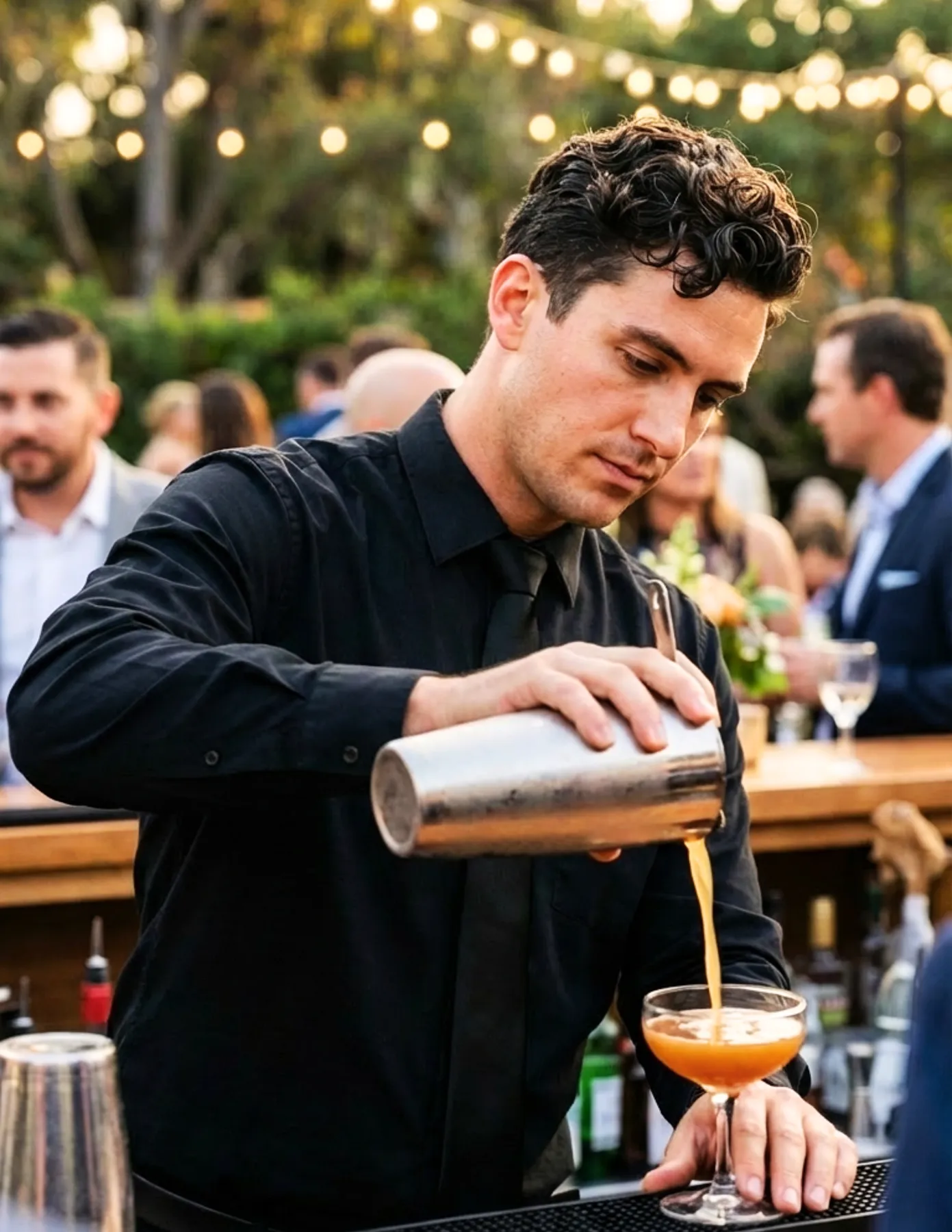 Professional bartender preparing cocktails at an event