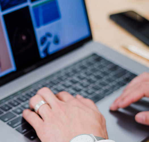 Hospitality staffing recruiter working on a laptop to source and place professional event staff for clients in New York and Chicago