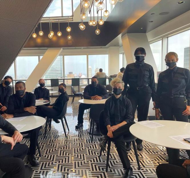 Professional hospitality staff preparing for service