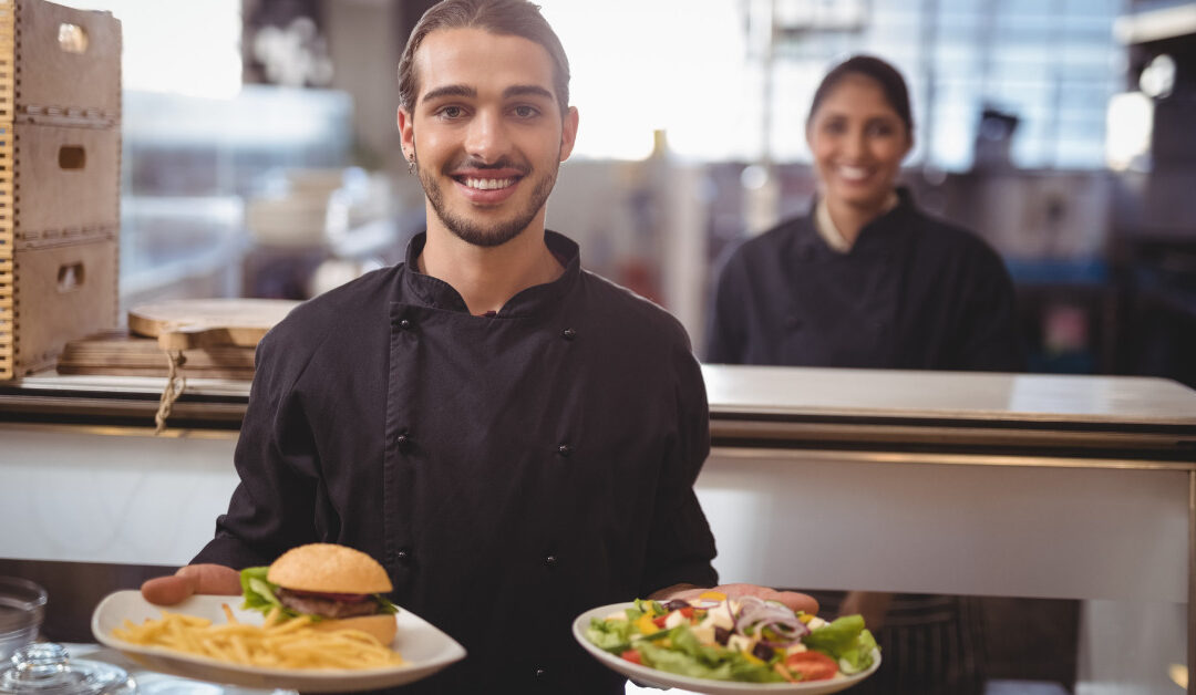 Restaurant service staff assisting diners